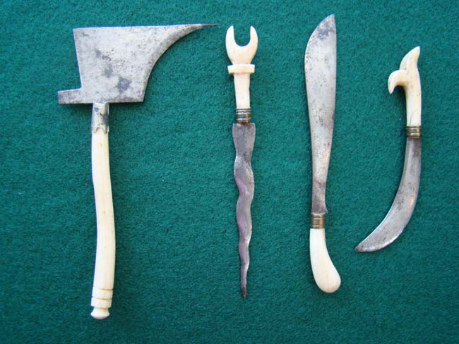 A group of four 19th century miniature steel bladed weapons with bone handles
